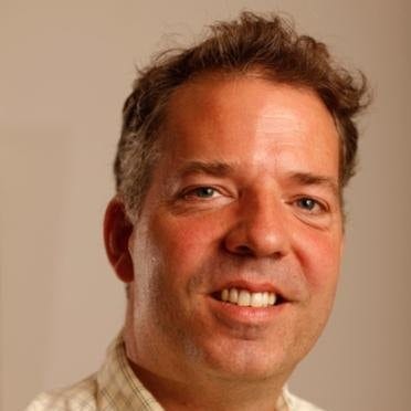 A close-up of a person smiling Description automatically generated