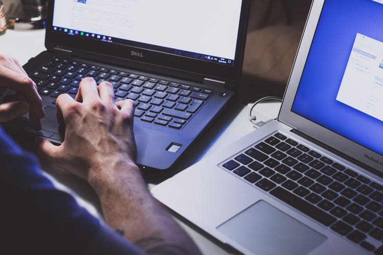 A person typing on a computer