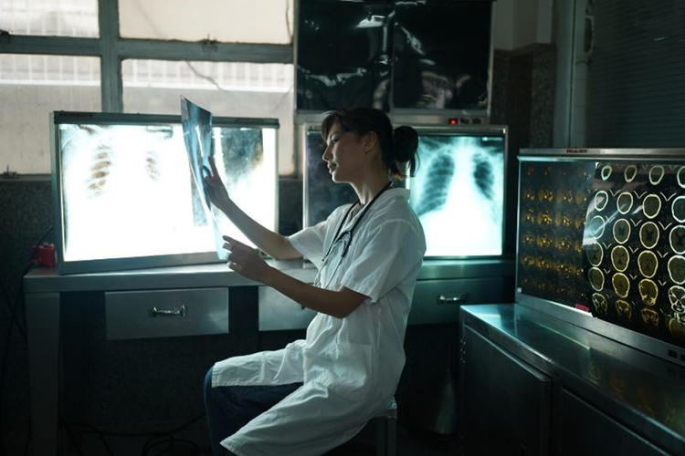 A Doctor Looking at MRI of a Cancer Patient