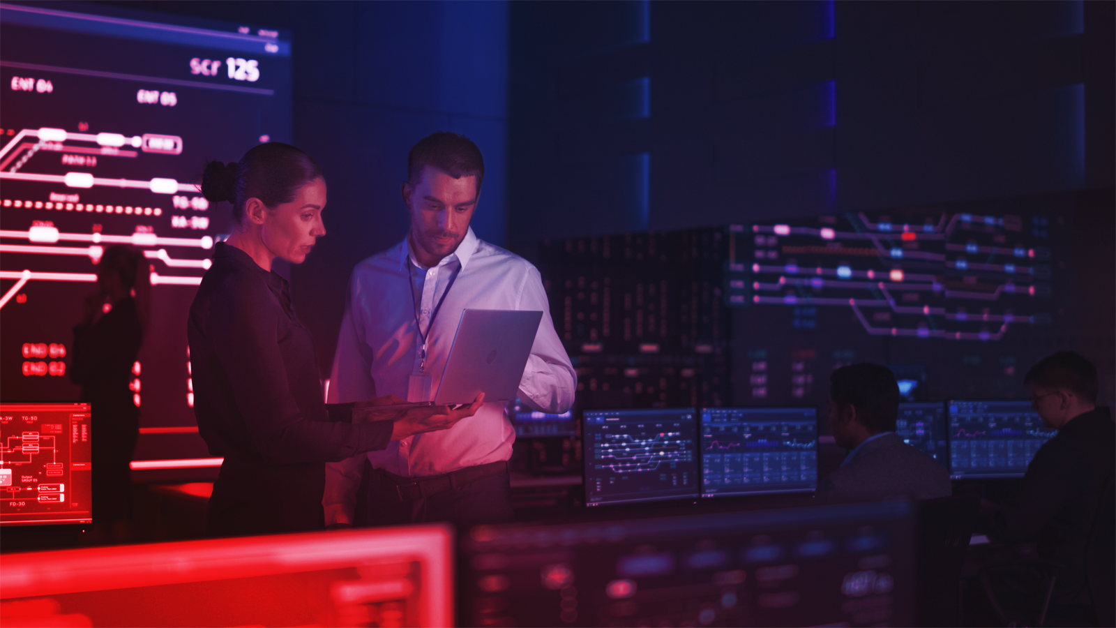 Two professionals assessing device performance