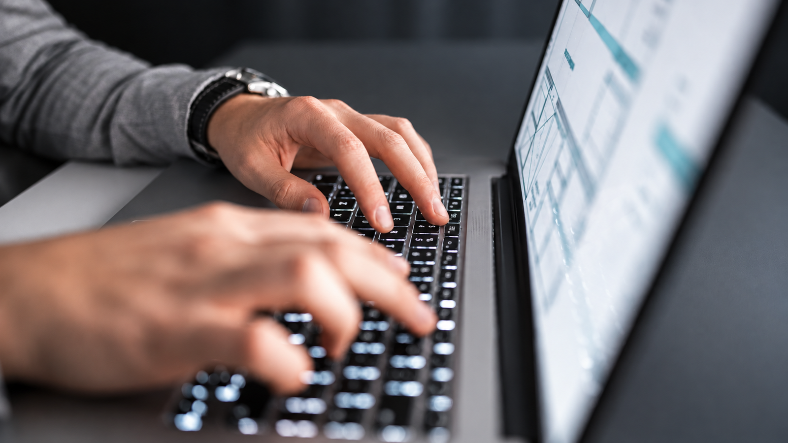 Person typing on laptop