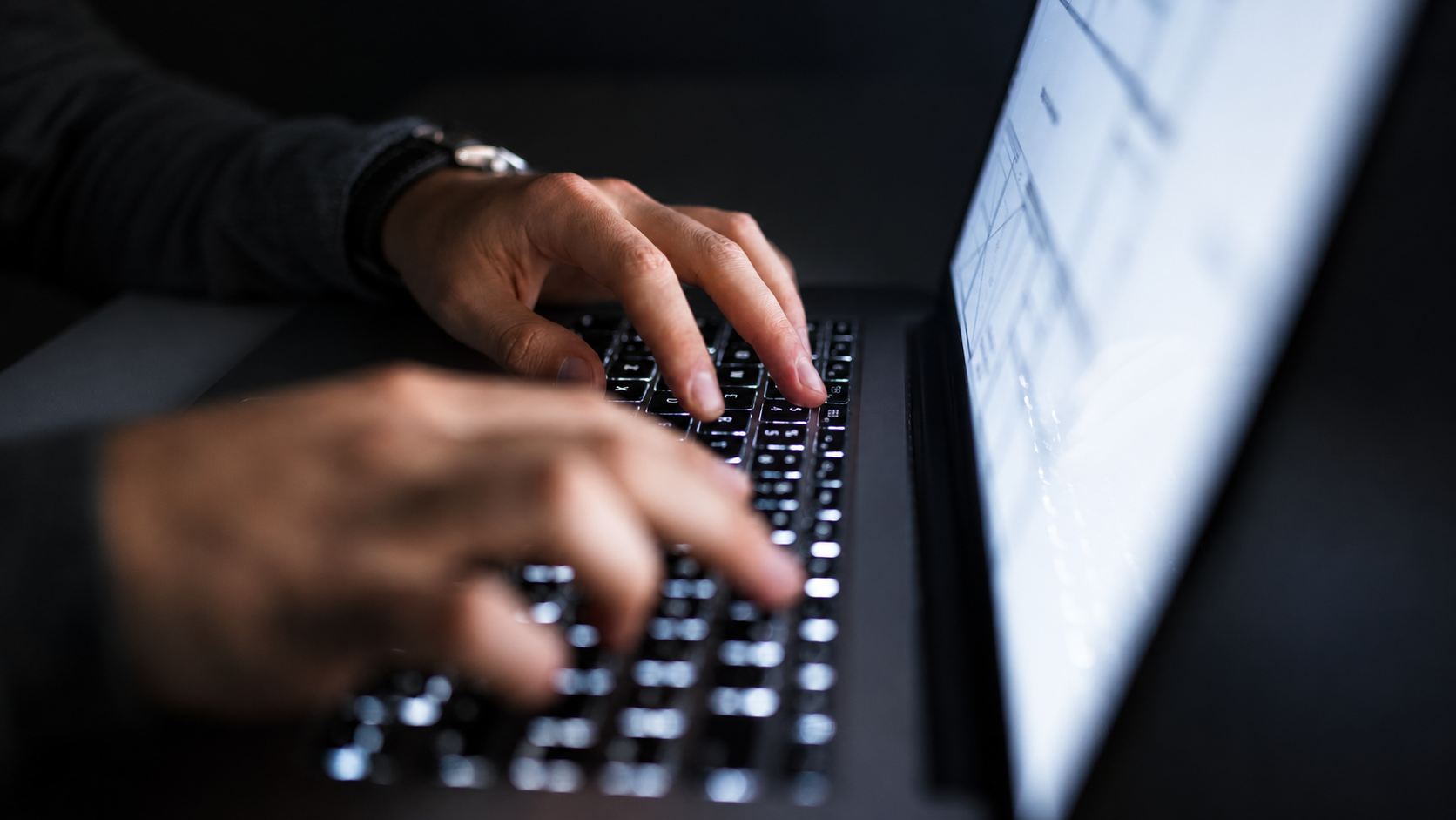 Person typing on laptop