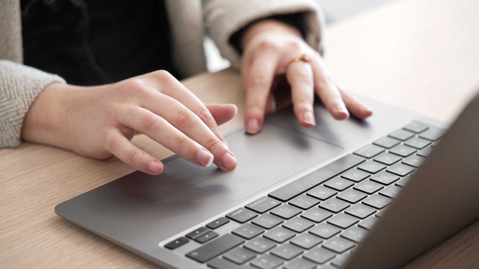 Closeup of hands researching EMVCo evaluations and certication